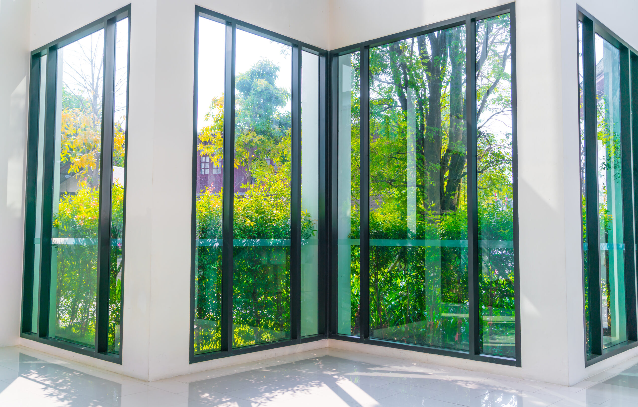 Glass window overlooking green garden